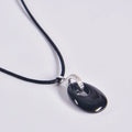 Colgante de piedra ónix negro ovalada con asa de plata rodiada y circonitas, incluye cordón negro, propiedades hipoalergénicas, selección Aura Plena