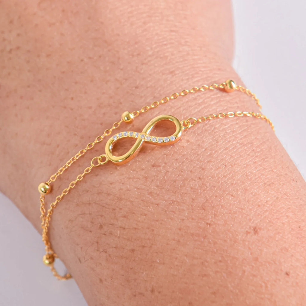 Pulsera Infinito Plata 925 Baño Oro y Circonitas  de doble cadena.