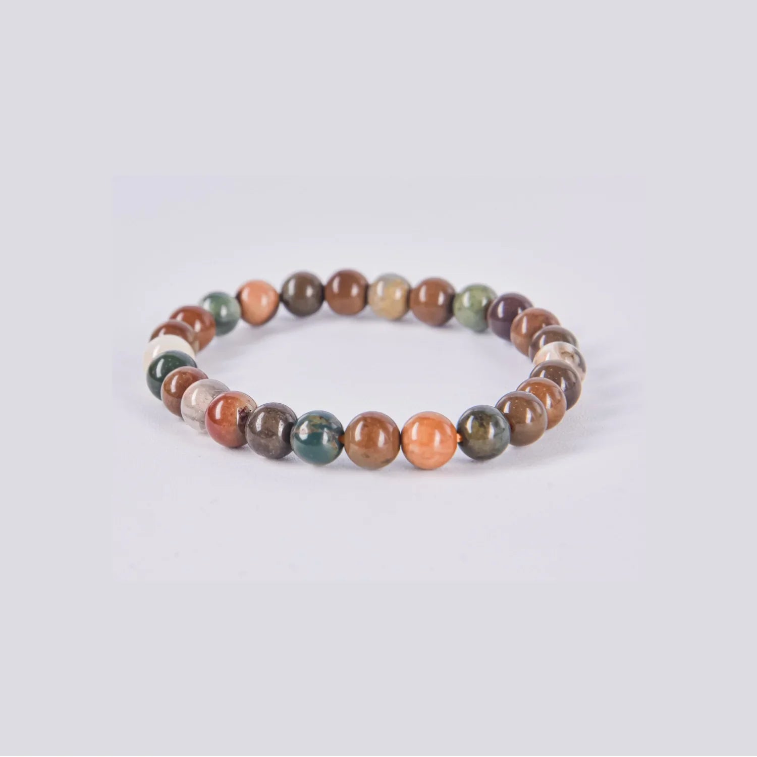 Pulsera de ágata india natural con esferas multicolor en tonos verdes, tierra y rojizos — Colección Aura Plena
