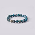 Pulsera elástica de Apatito Azul natural con tonos azul cerceta profundo y vetas verdes oceánicas. Piedra de la motivación y el enfoque.